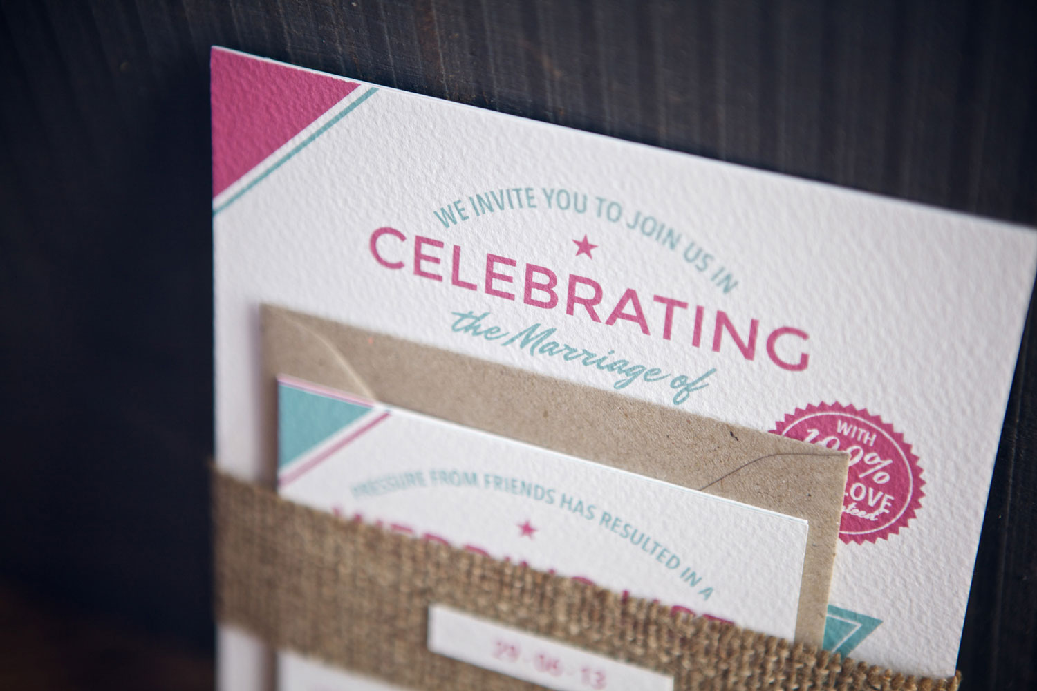 Collection of white, pink and blue wedding stationery