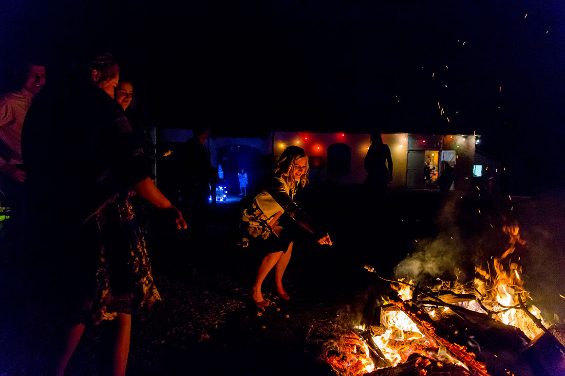 Guests enjoy an evening bonfire
