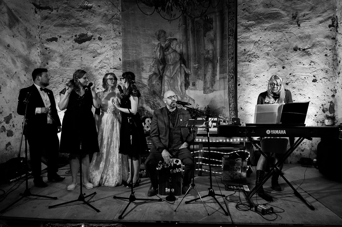 A band and backing singers entertain the guests