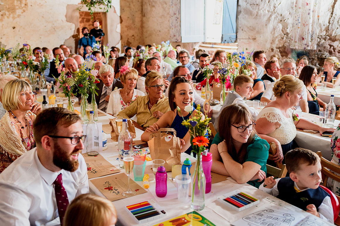 Wedding guests enjoy the speeches